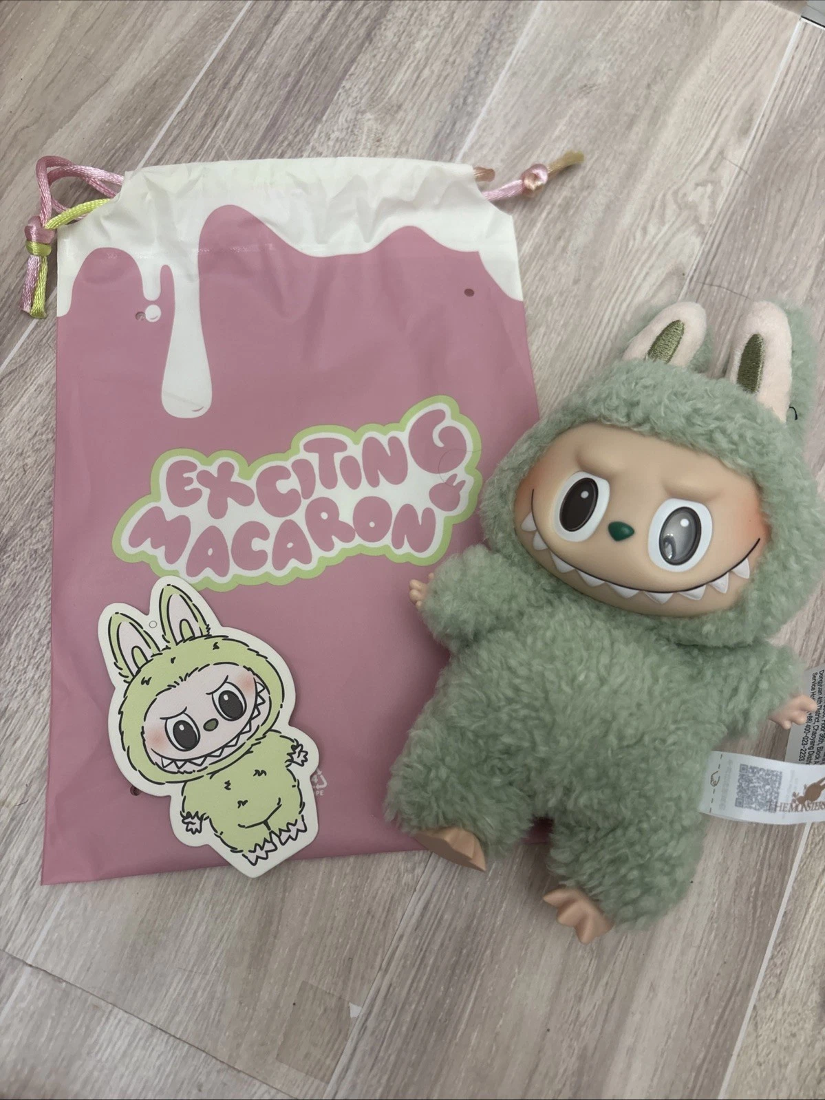 Pop Mart The Monsters Labubu plush toy in the "Exciting Macaron Green Grape
